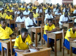 Some BECE candidates writing a paper